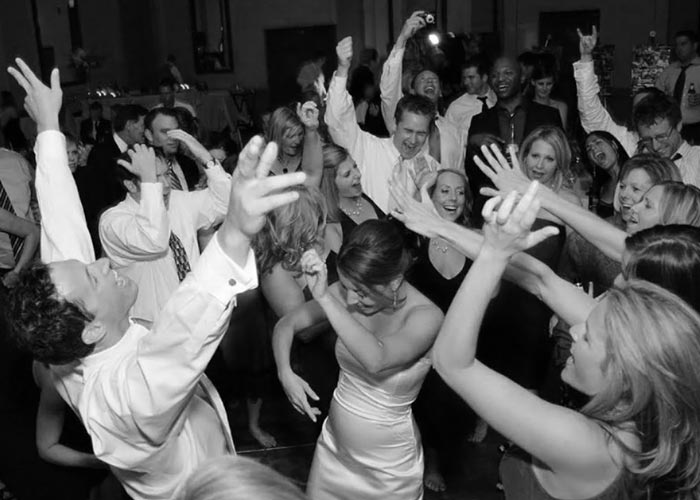 Crowd dancing at wedding
